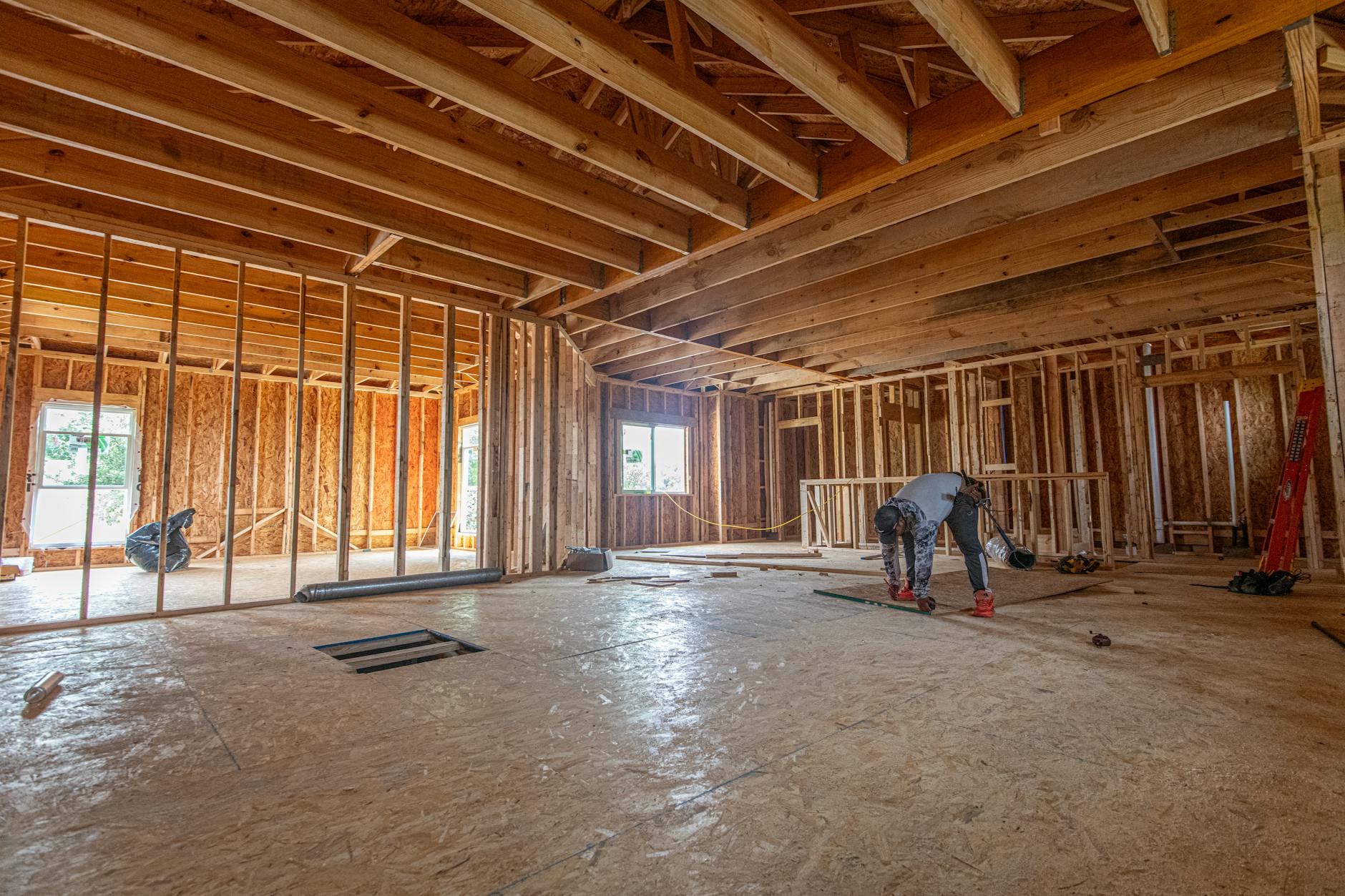 Residential home addition construction reference with interior framing in progress.