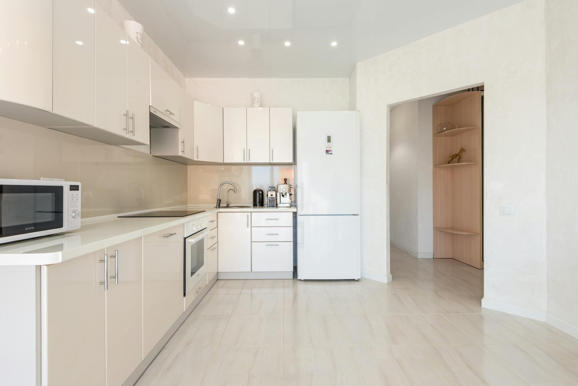 Kitchen cabinet layout reference with built-in oven and clean counters.